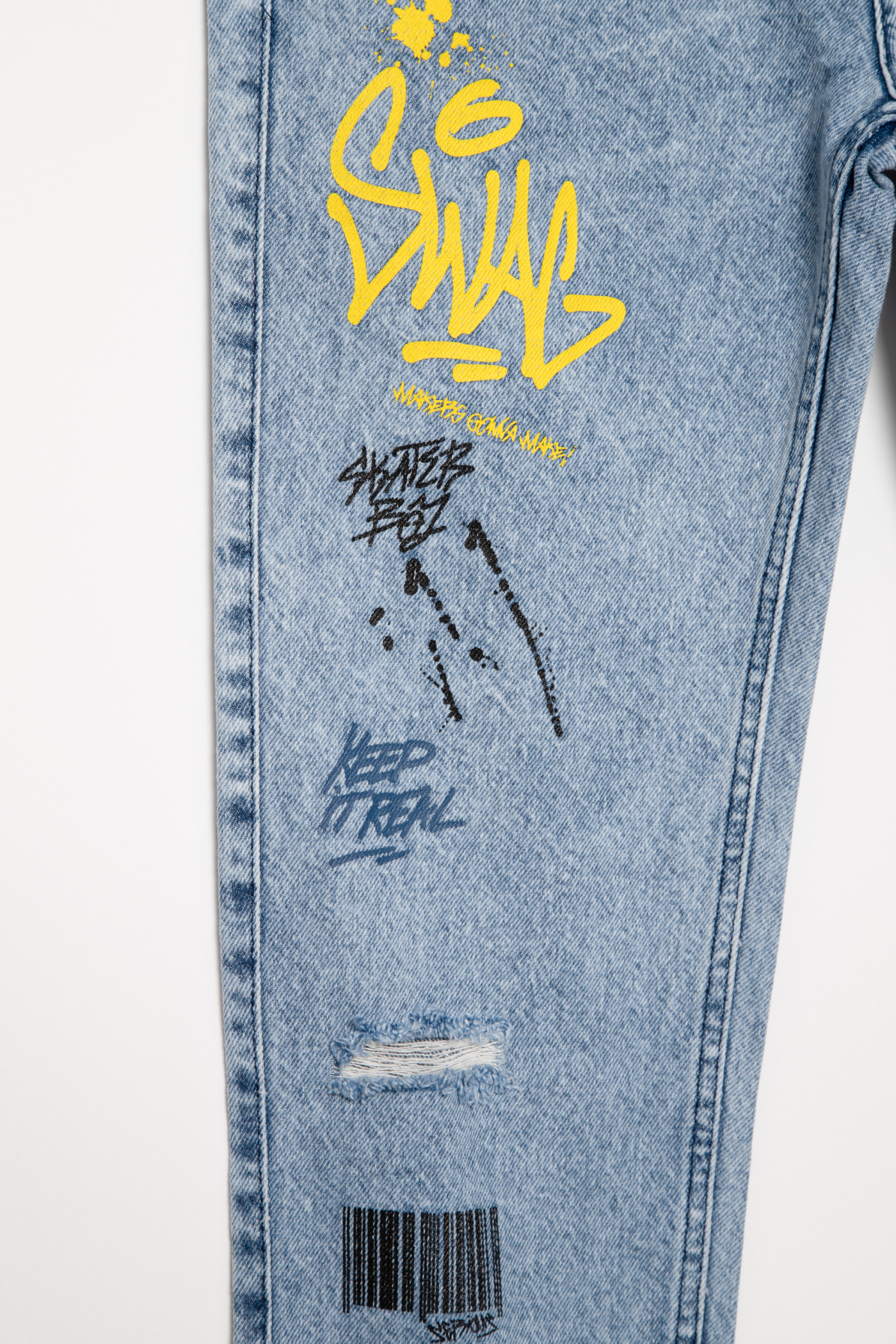 Niebieskie jeansy typu jogger z nadrukami dla chłopaka