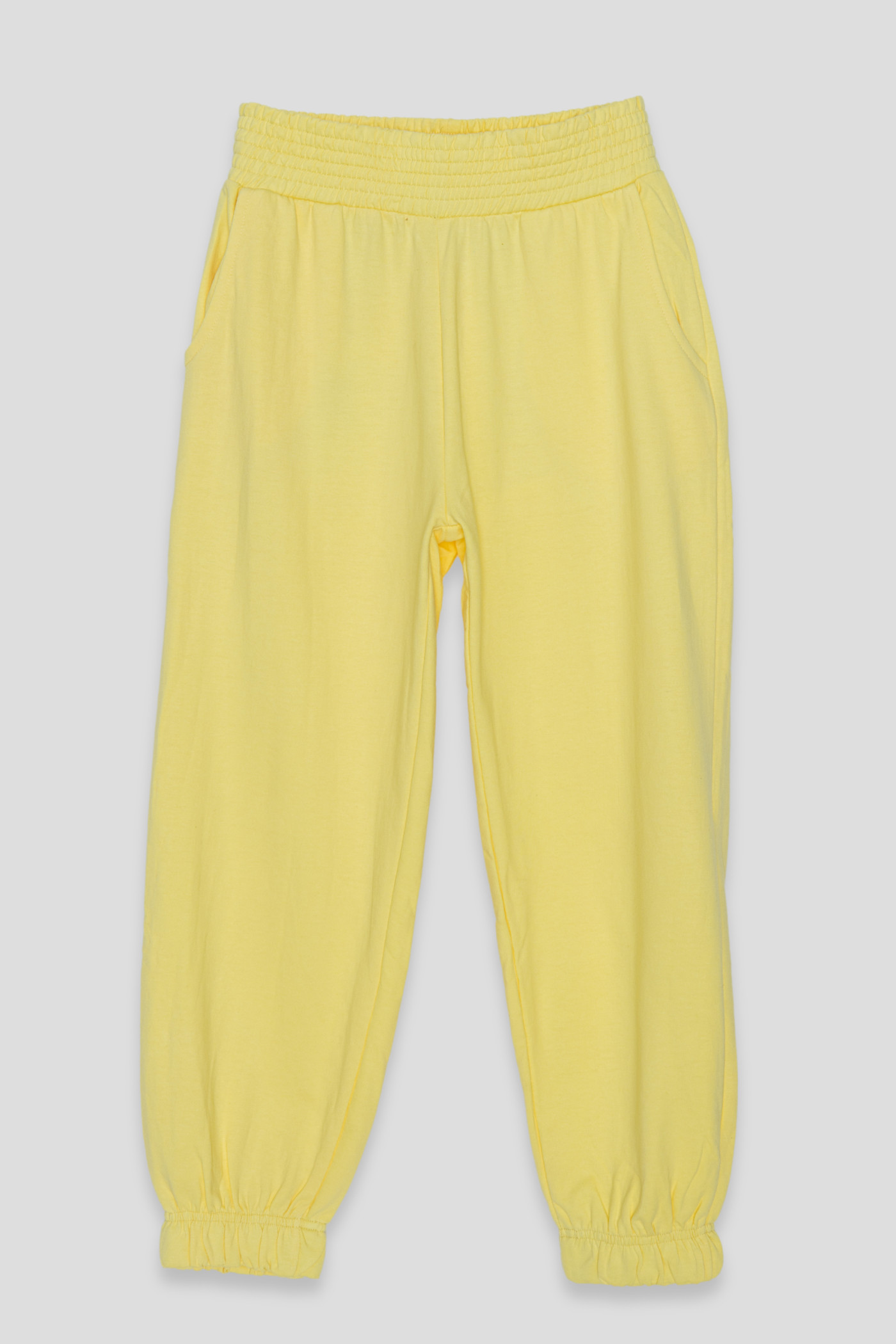 Żółte pastelowe spodnie dresowe ze ściągaczem