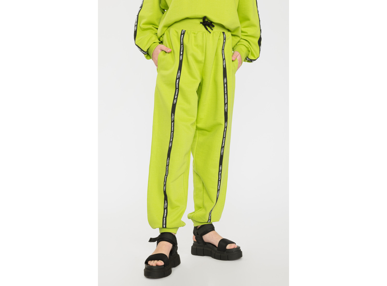 Limonkowe spodnie dresowe z ozdobnymi taśmami NO YOUTH CONTROL