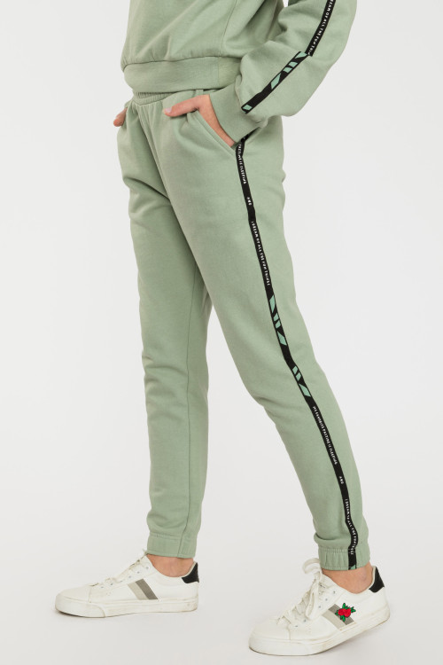 Pistacjowe spodnie dresowe z lampasami