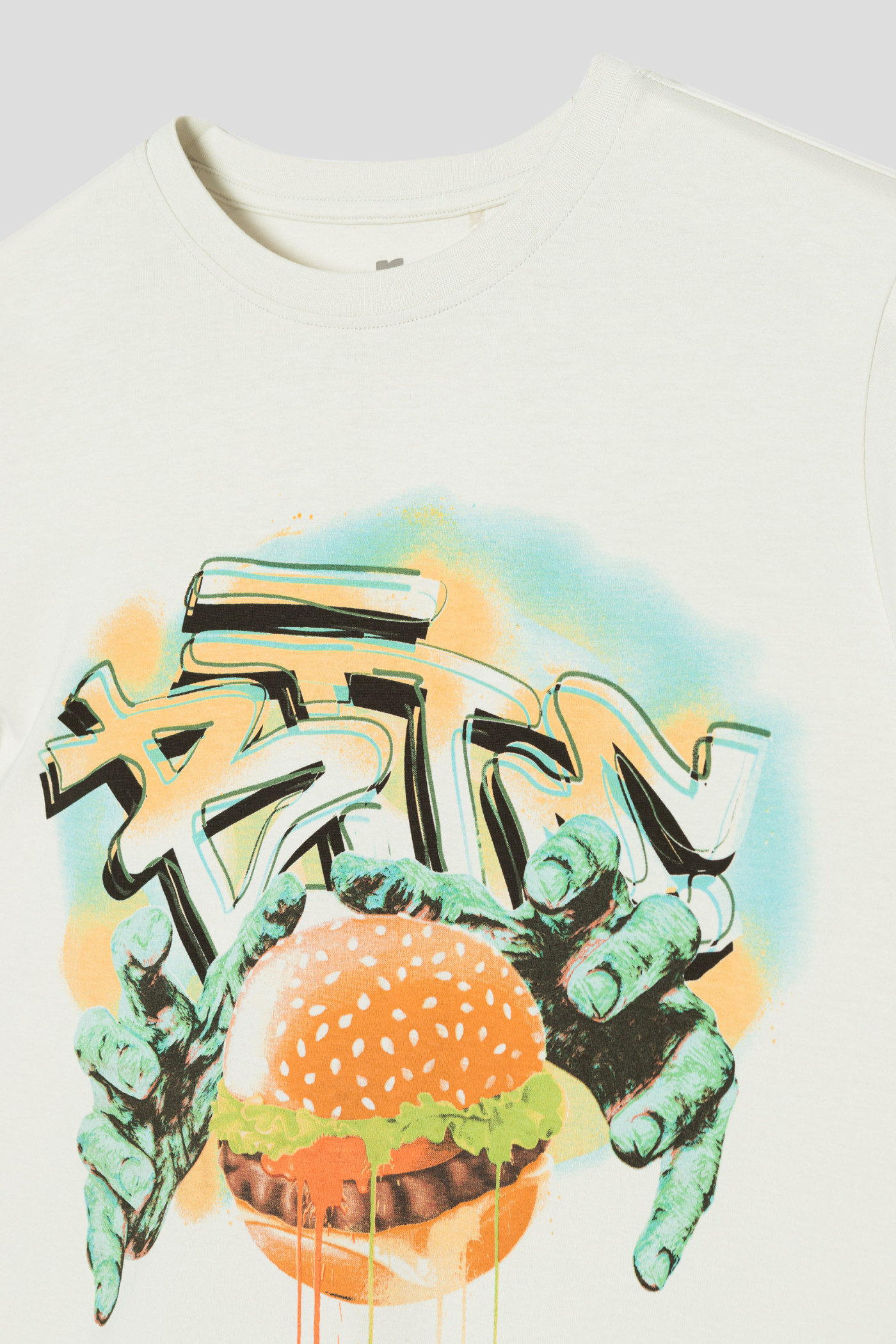 Beżowy T-shirt z nadrukiem graffiti