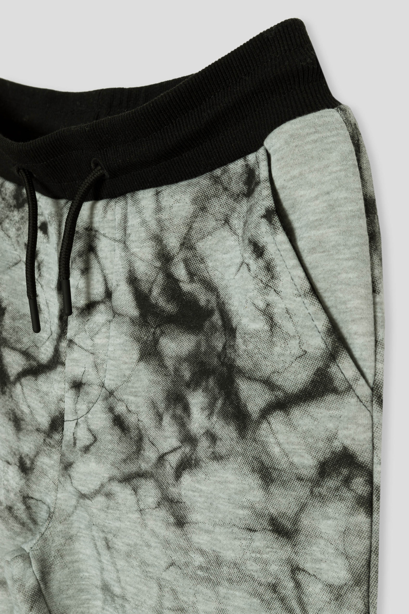 Szare spodnie dresowe z nadrukami