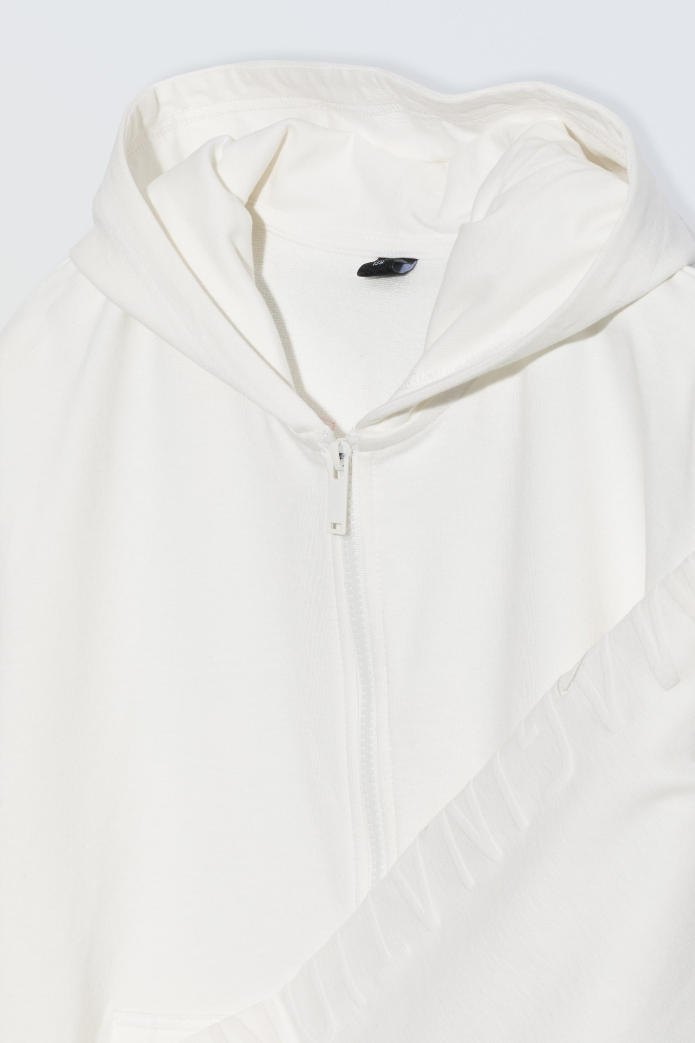 Biała bluza z kapturem zapinana na zamek