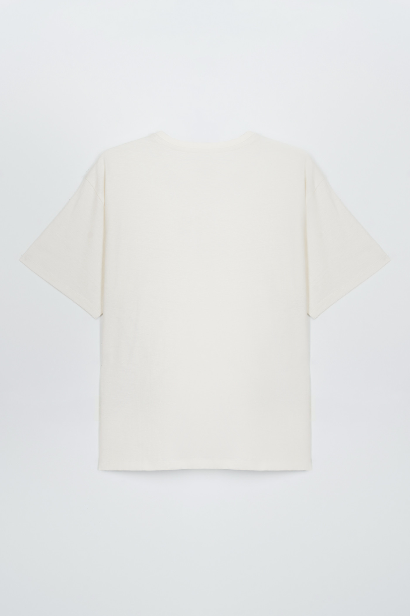 Beżowy t-shirt z kolorowymi nadrukami z przodu