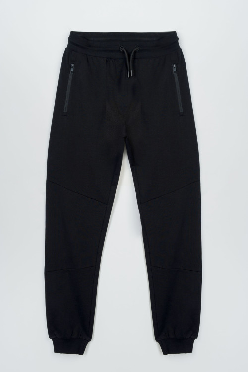 Czarne spodnie dresowe z modnymi cięciami na nogawkach