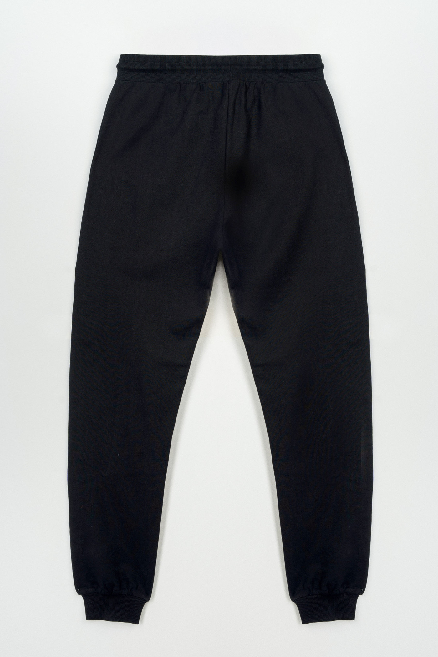 Czarne spodnie dresowe z modnymi cięciami na nogawkach