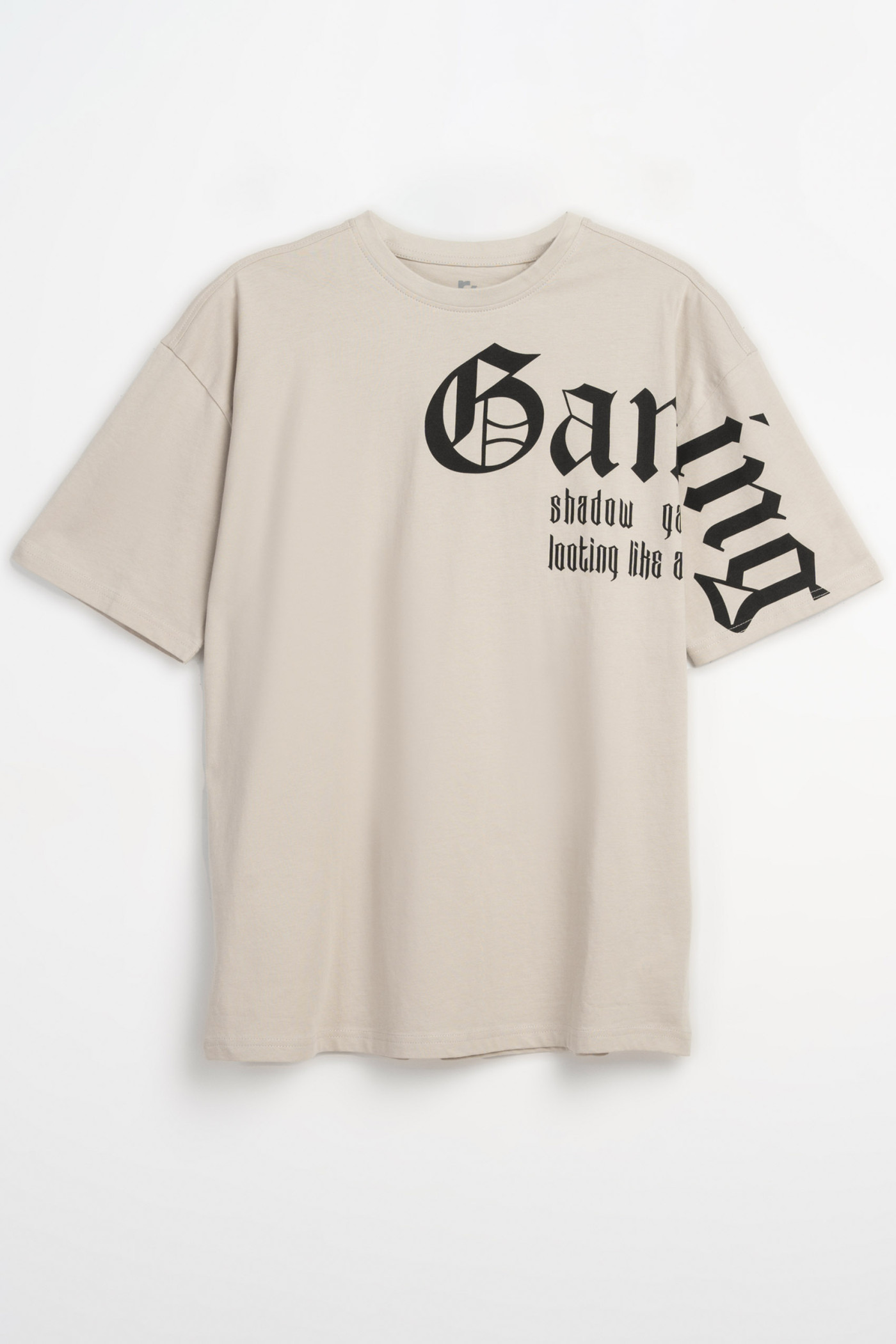 Jasnobeżowy t-shirt oversize z autorską grafiką z przodu