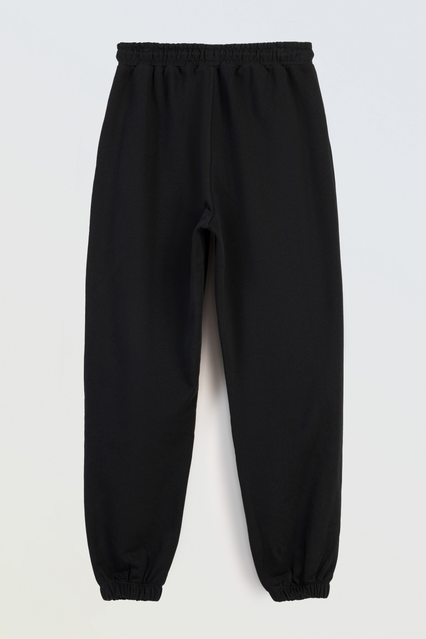 Czarne spodnie dresowe z modnymi cięciami Czarne spodnie dresowe z modnymi cięciami