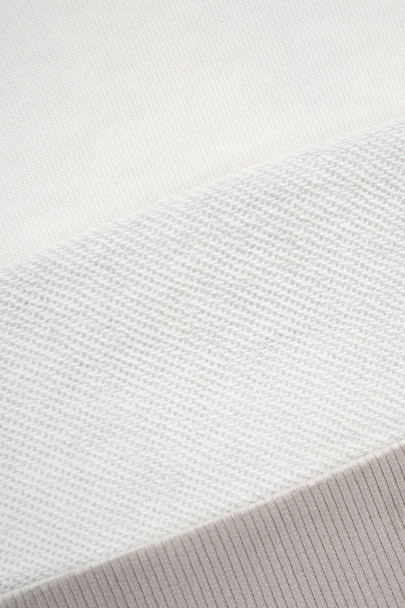 Kremowa bluza z kapturem z autorską grafiką z przodu Kremowa bluza z kapturem z autorską grafiką z przodu