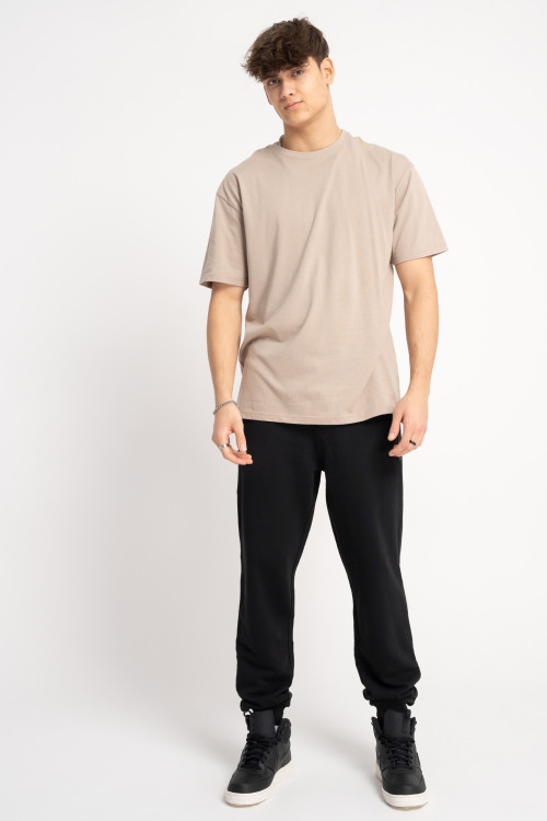 Czarne spodnie dresowe REGULAR z autorską grafiką na nogawce