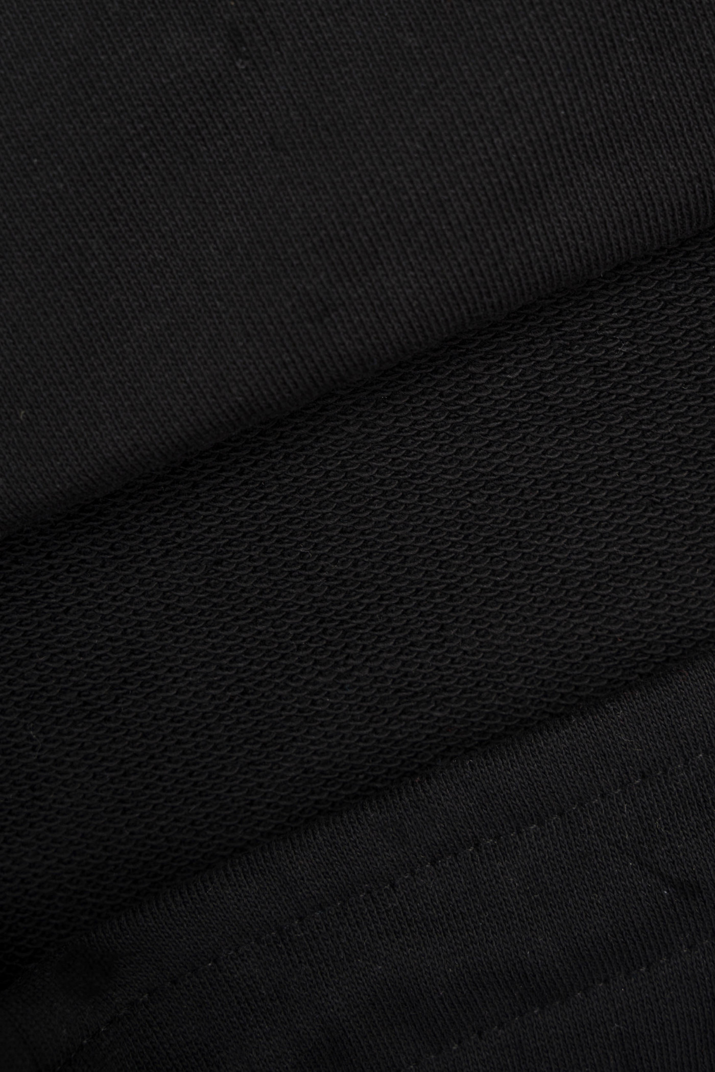 Czarne spodnie dresowe REGULAR z autorską grafiką na nogawce