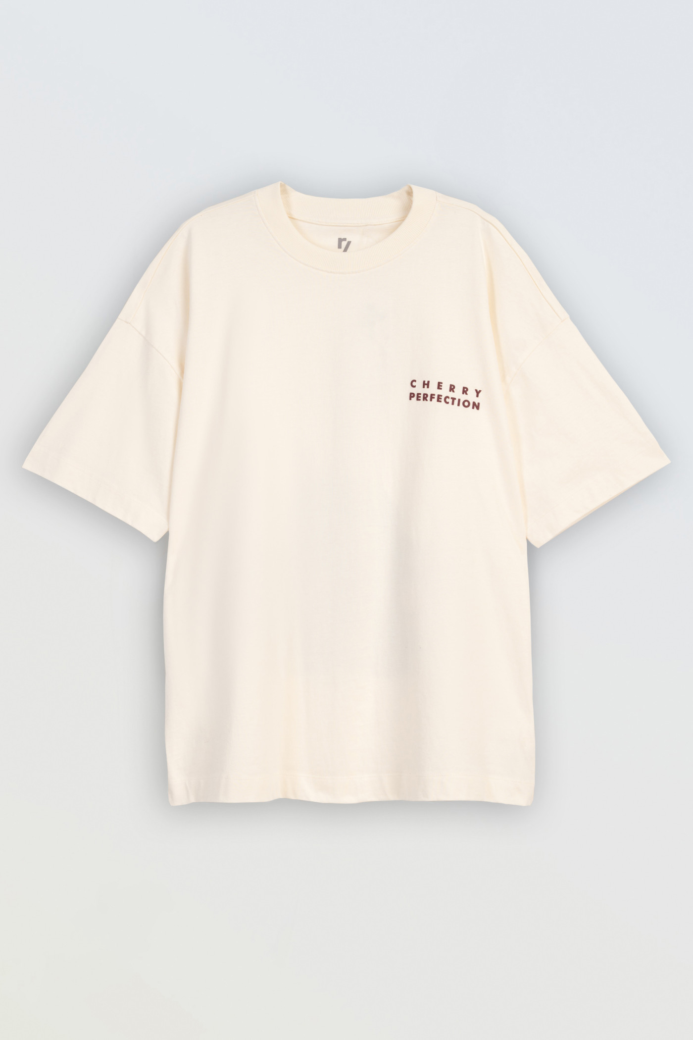 Kremowy t-shirt oversize z autorską grafiką z tyłu