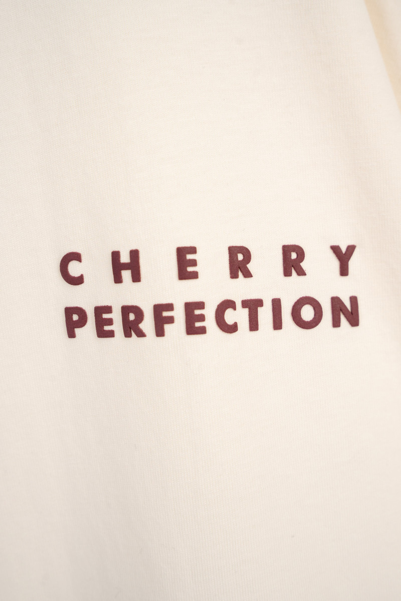 Kremowy t-shirt oversize z autorską grafiką z tyłu