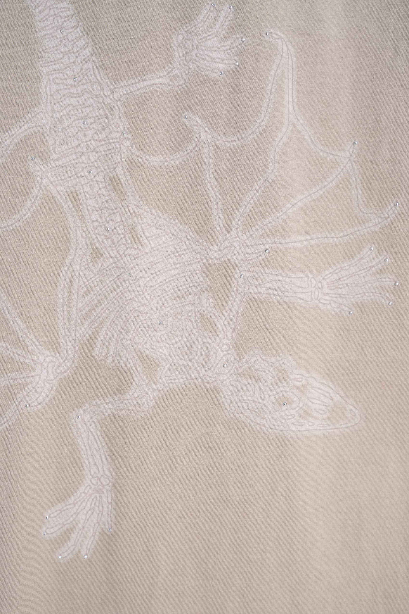 Beżowy t-shirt z autorską grafiką z przodu z kryształkami