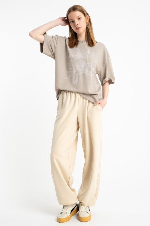 Kremowe spodnie dresowe OVERSIZE bez nadruków