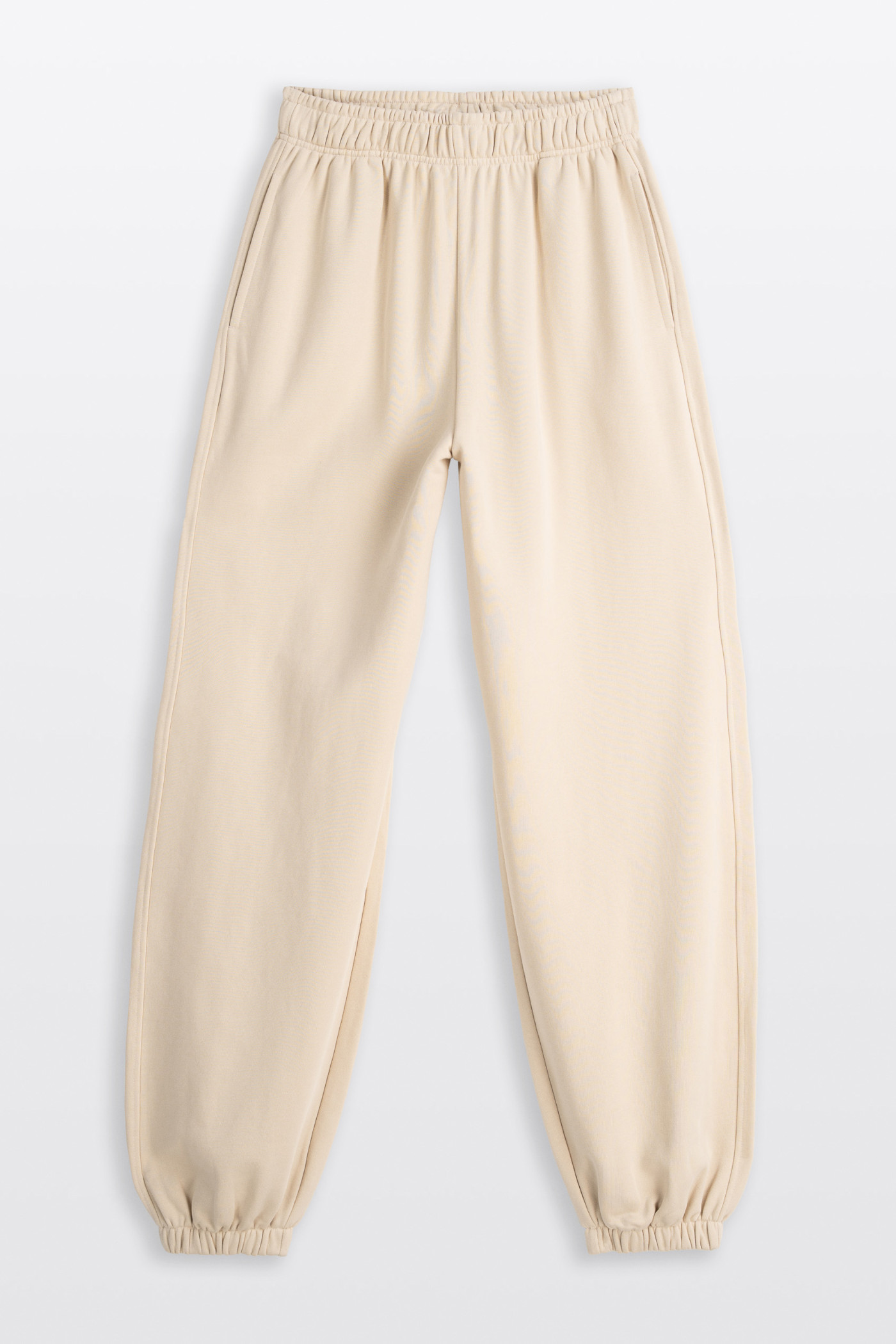Kremowe spodnie dresowe OVERSIZE bez nadruków