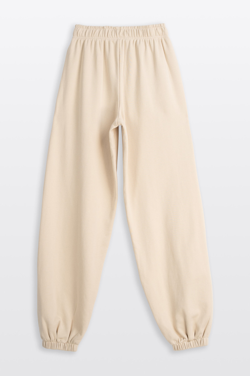 Kremowe spodnie dresowe OVERSIZE bez nadruków