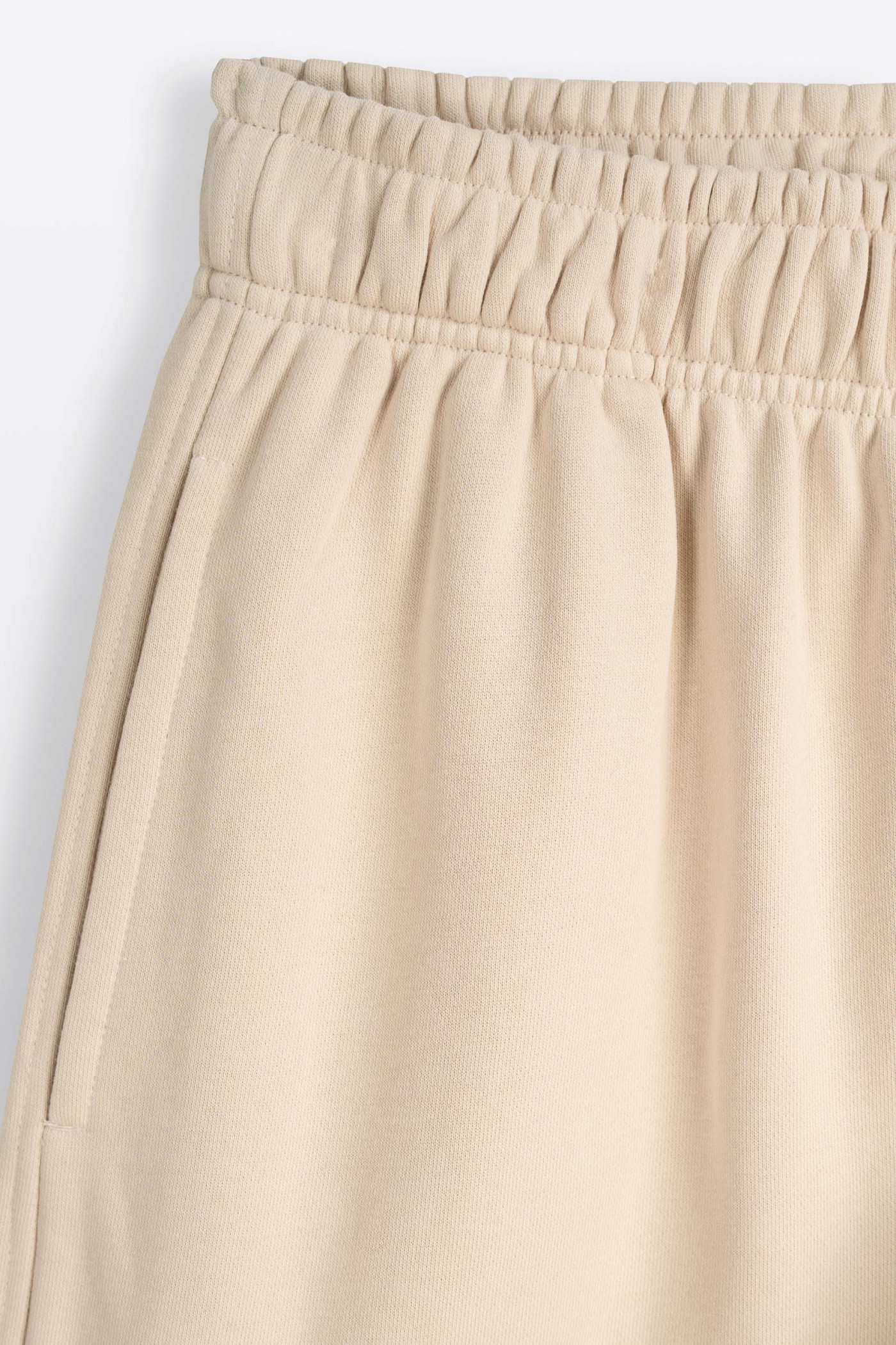 Kremowe spodnie dresowe OVERSIZE bez nadruków