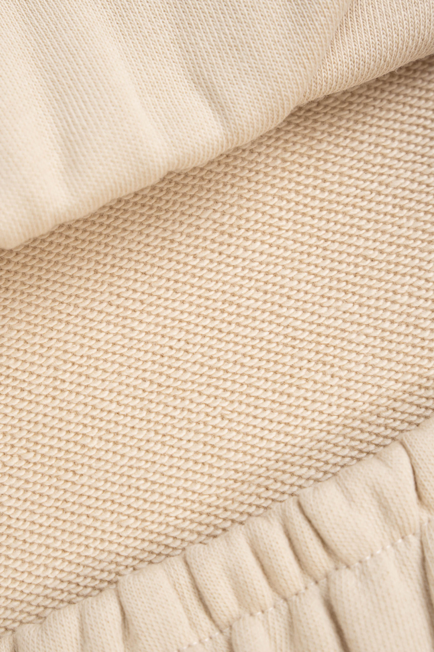 Kremowe spodnie dresowe OVERSIZE bez nadruków