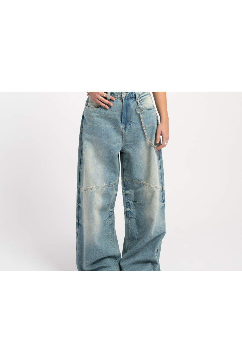 Niebieskie jeansy z szerokimi nogawkami z modnymi cięciami, niebieski