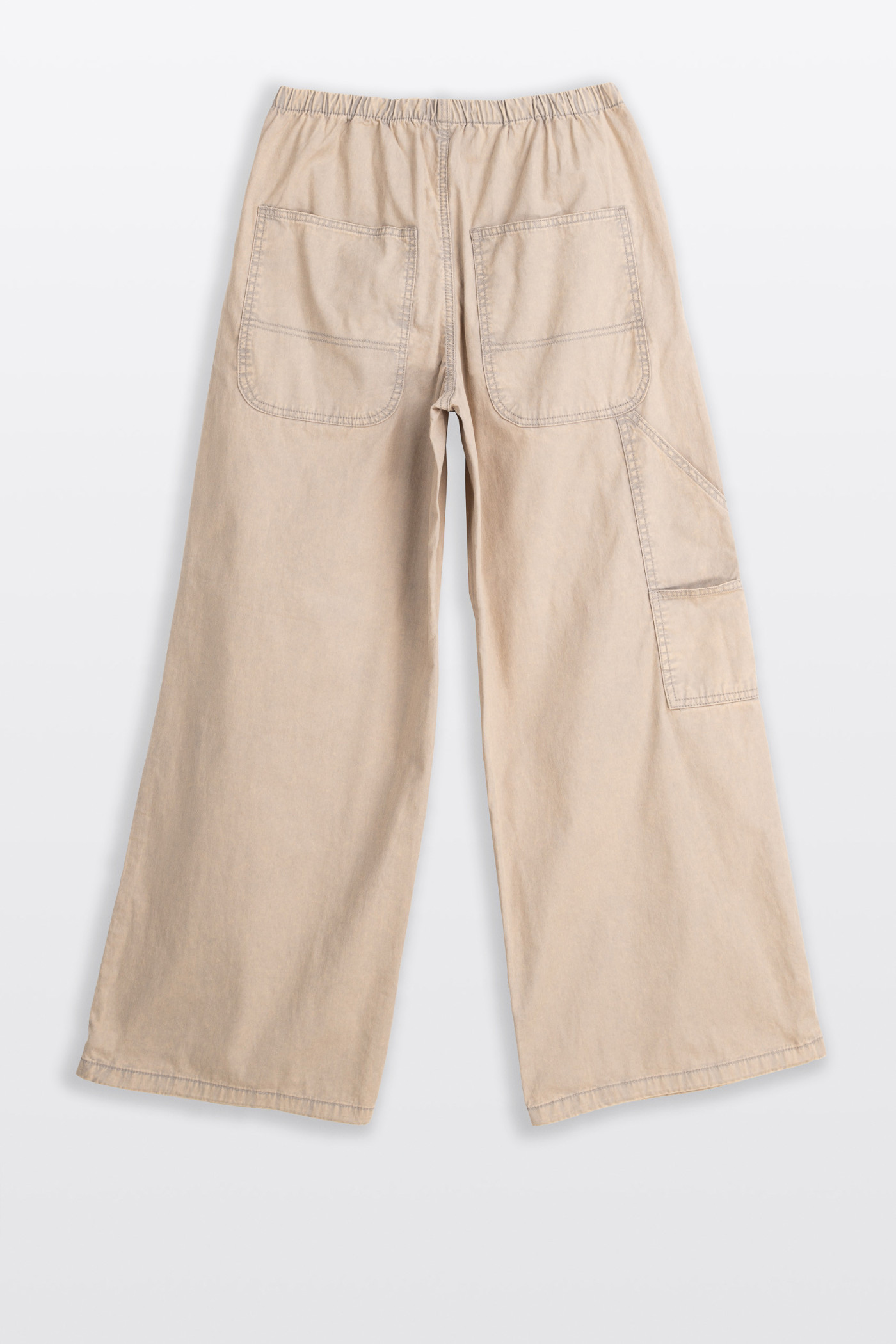 Beżowe spodnie typu PARACHUTE z zaszewkami na kolanach