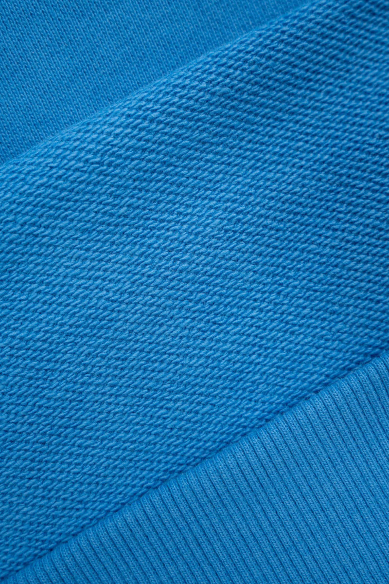 Niebieska bluza OVERSIZE z kapturem z aplikacją z tyłu