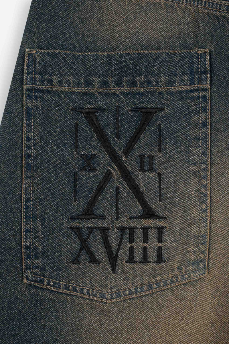 Granatowe spodnie jeansowe o kroju BAGGY z efektem sprania