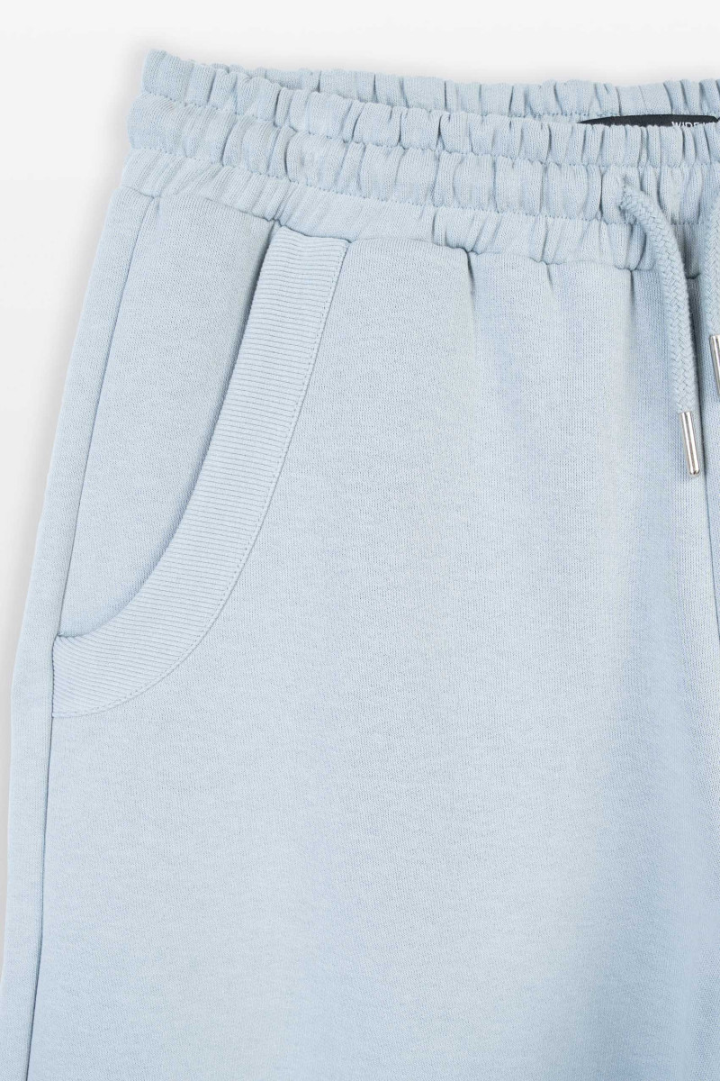 Jasnoniebieskie spodnie dresowe UNISEX WIDE LEG, niebieski