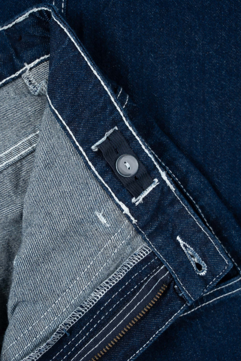 Granatowe spodnie jeansowe o kroju BAGGY z kontrastowymi przeszyciami