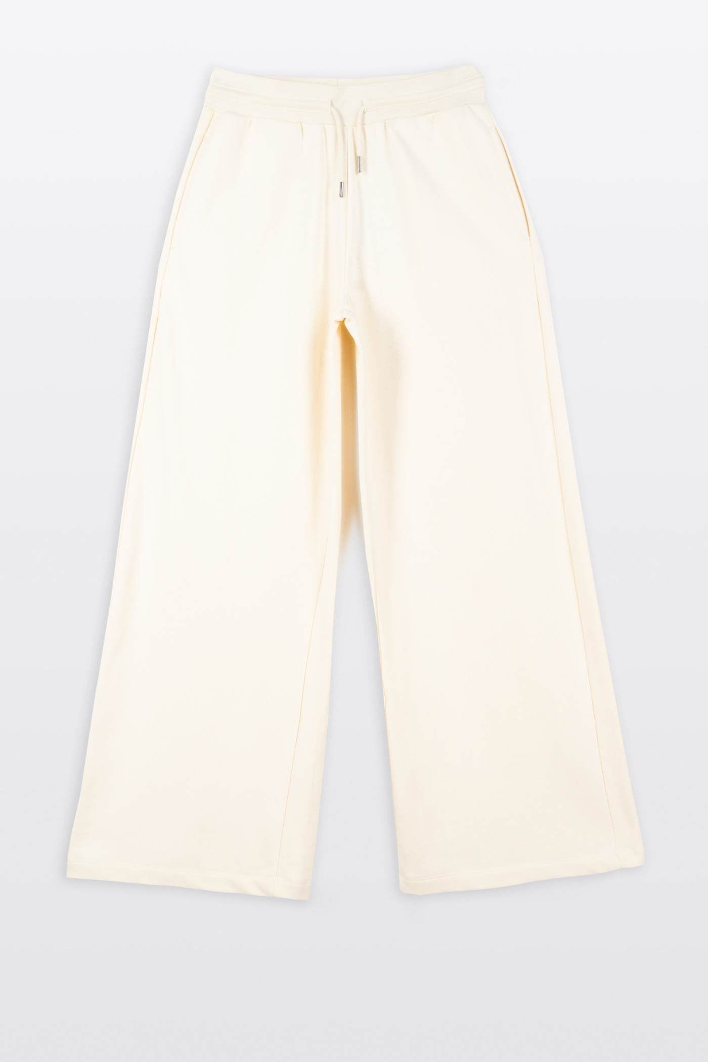 Kremowe spodnie dresowe z szerokimi nogawkami bez nadruków