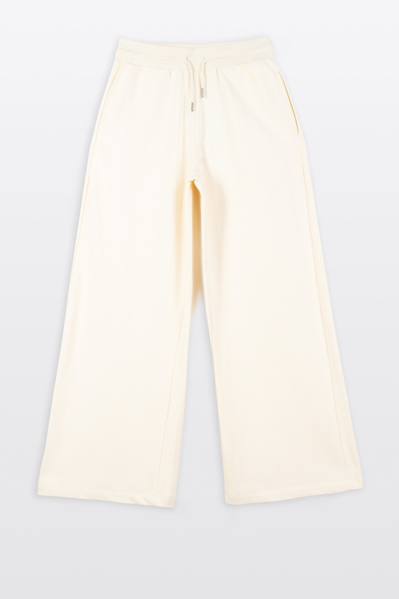 Kremowe spodnie dresowe z szerokimi nogawkami bez nadruków