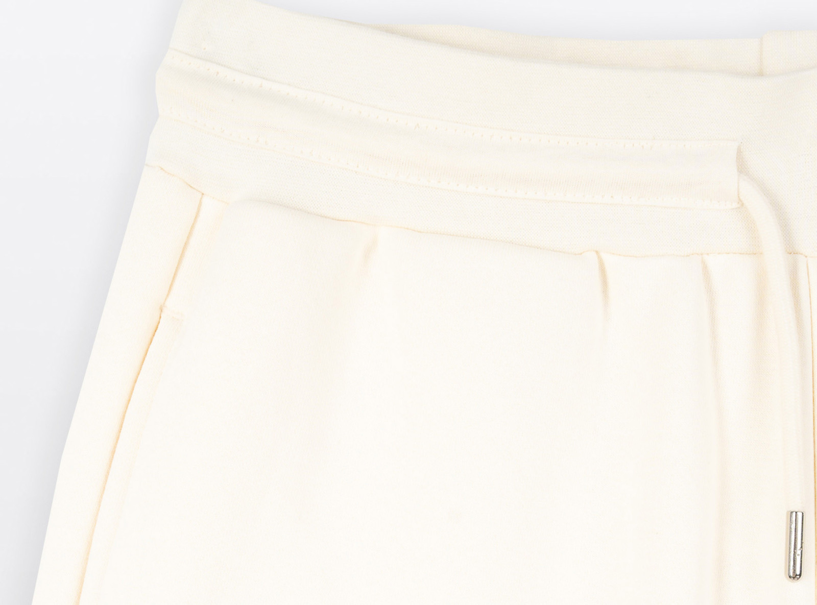 Kremowe spodnie dresowe z szerokimi nogawkami bez nadruków