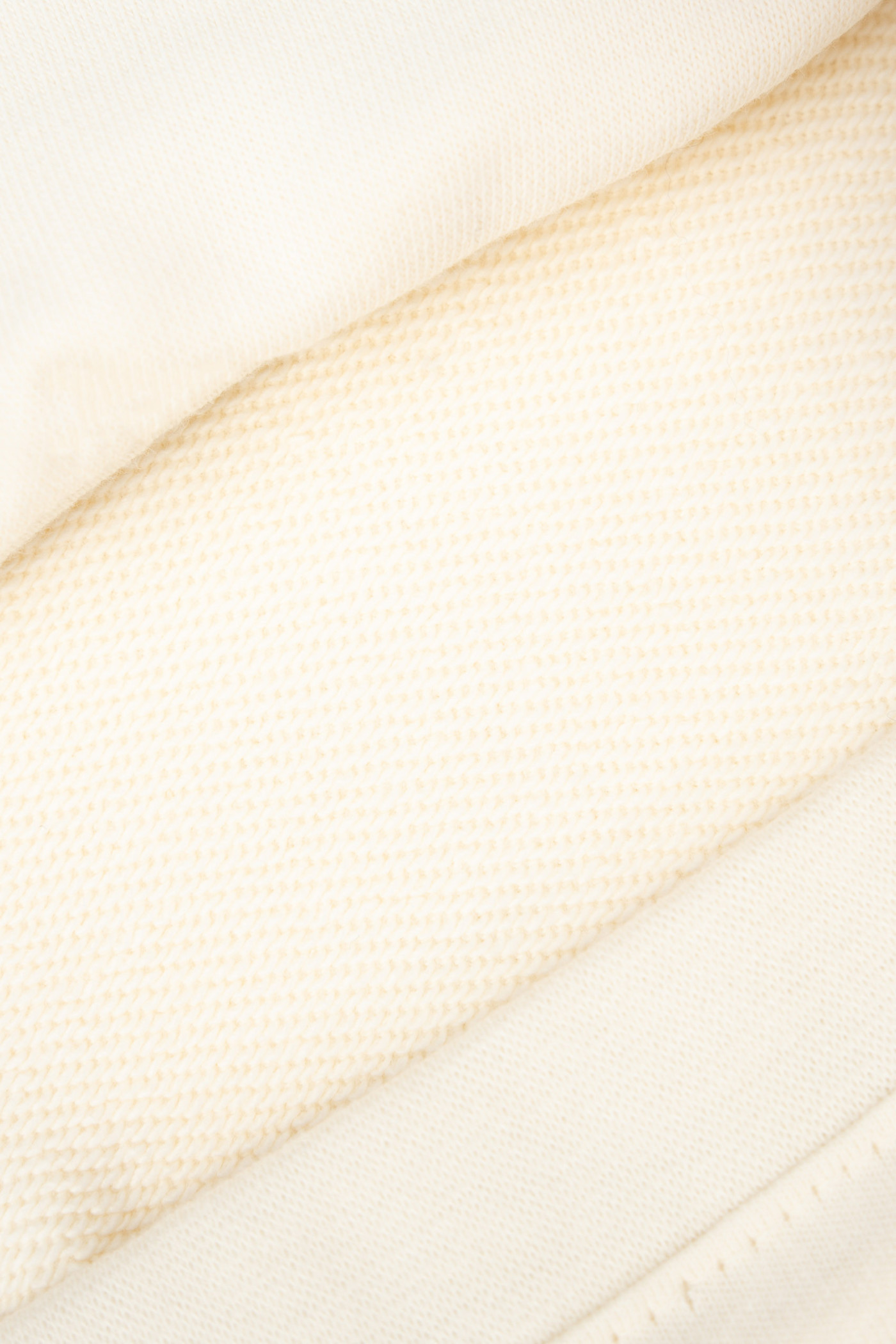 Kremowe spodnie dresowe z szerokimi nogawkami bez nadruków