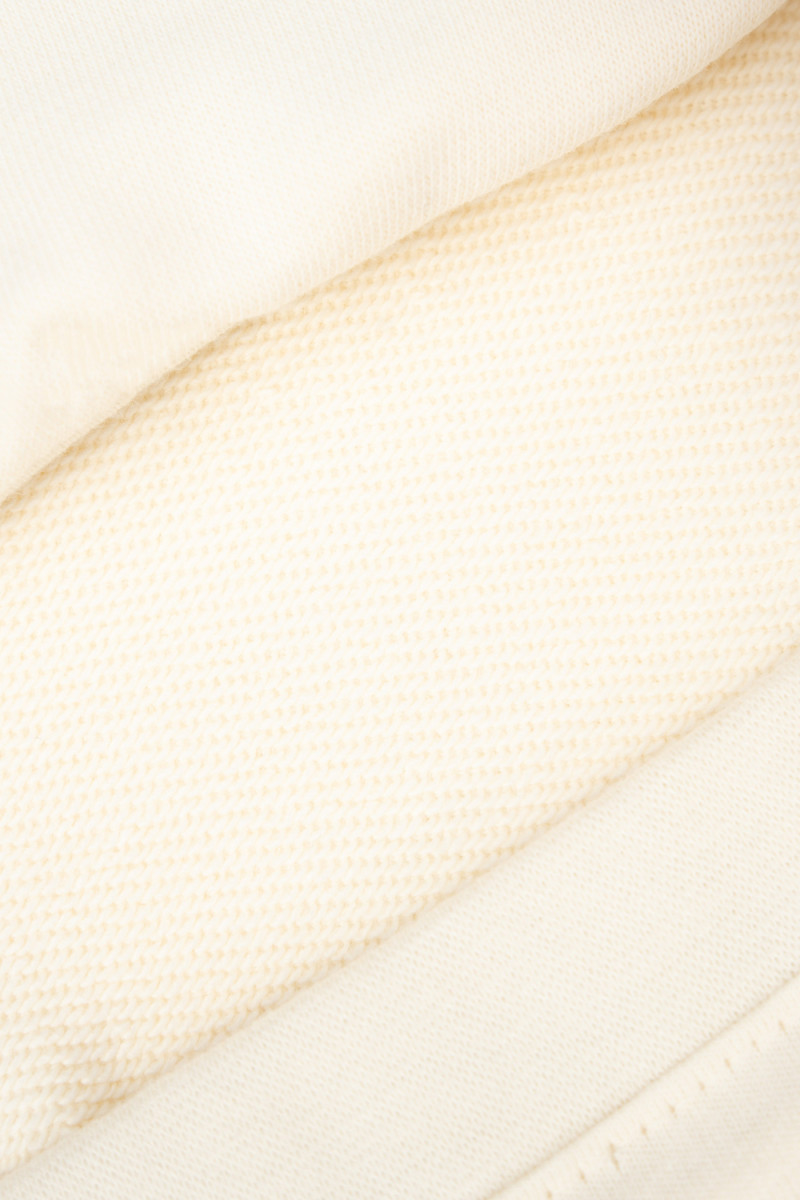 Kremowe spodnie dresowe z szerokimi nogawkami bez nadruków