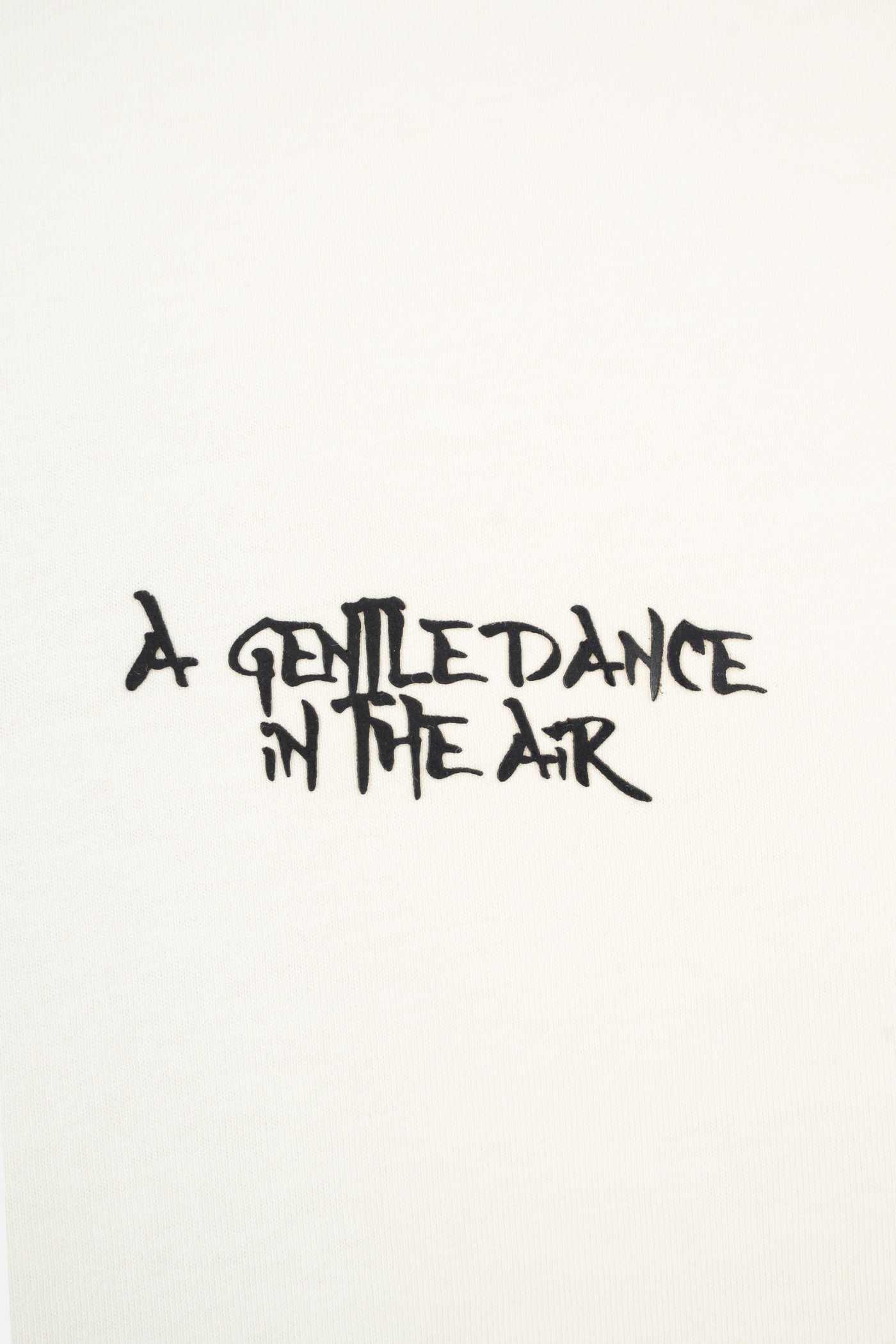 Kremowy t-shirt LOOSE z autorską grafiką z tyłu