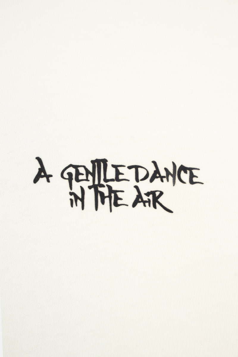 Kremowy t-shirt LOOSE z autorską grafiką z tyłu