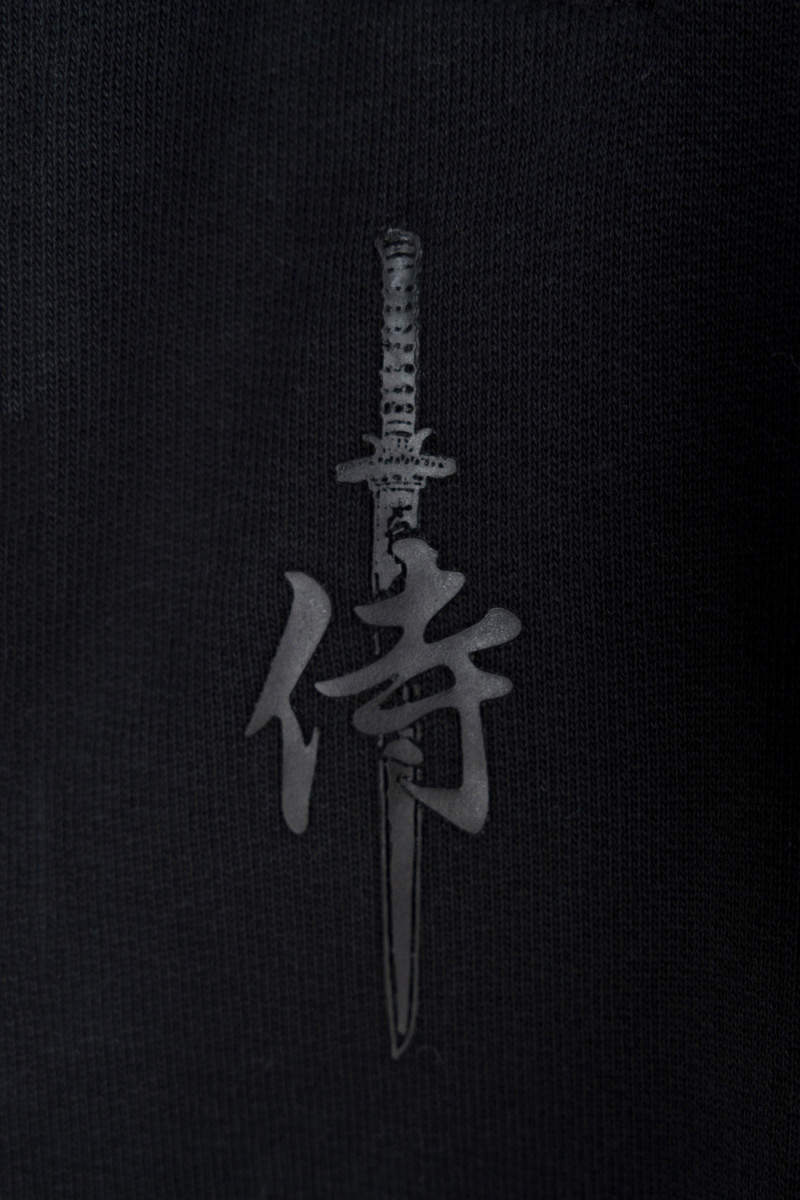 Czarne spodnie dresowe OVERSIZE z minimalistycznym nadrukiem