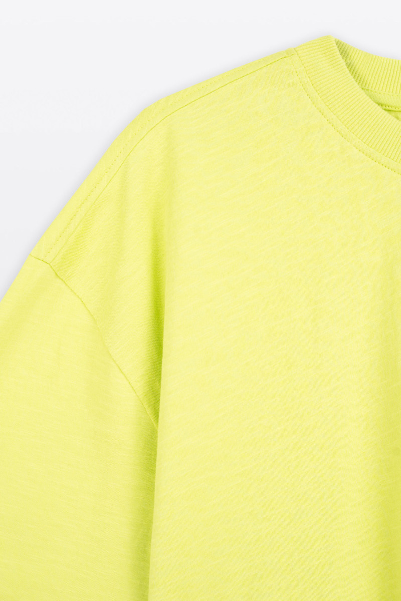 Limonkowy t-shirt LOOSE z autorską grafiką z tyłu