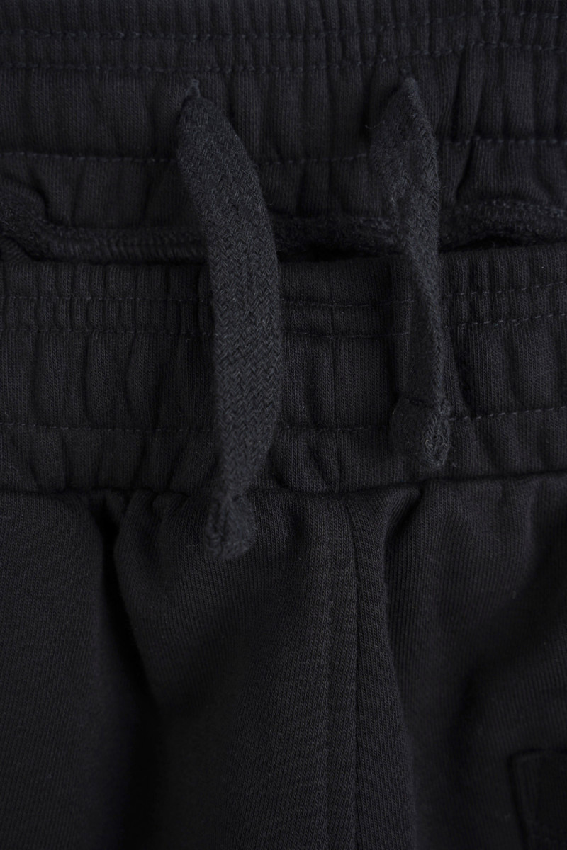 Czarne spodnie dresowe o kroju BARREL bez nadruków, czarny