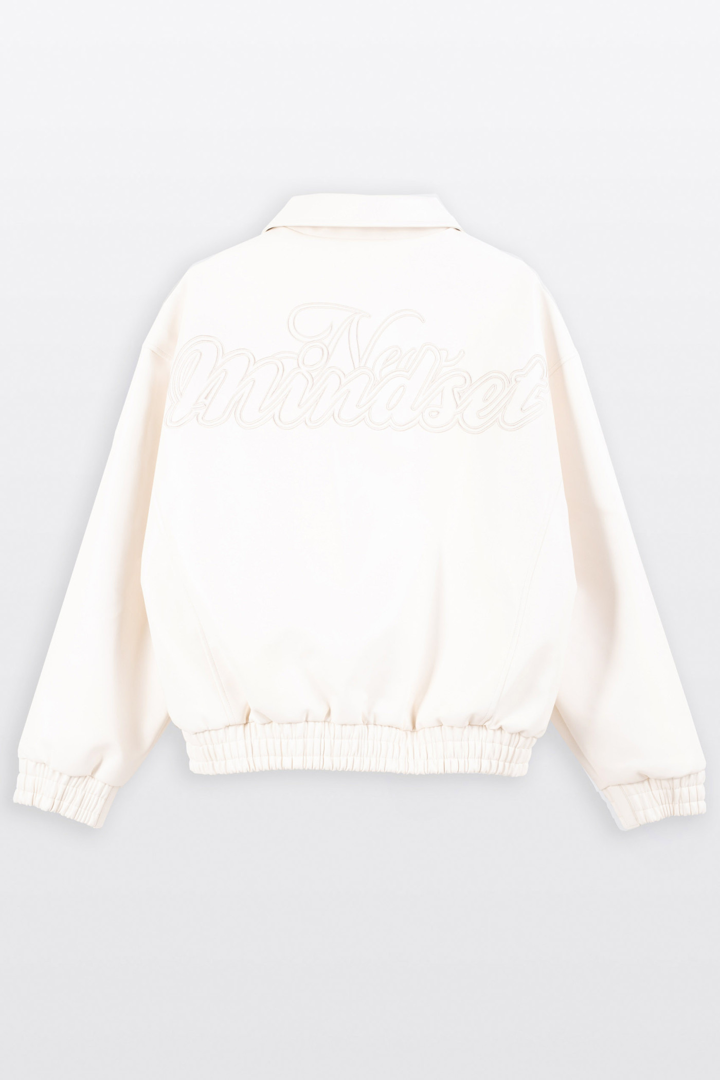 Kremowa kurtka ze skóry ekologicznej z modnym haftem z tyłu