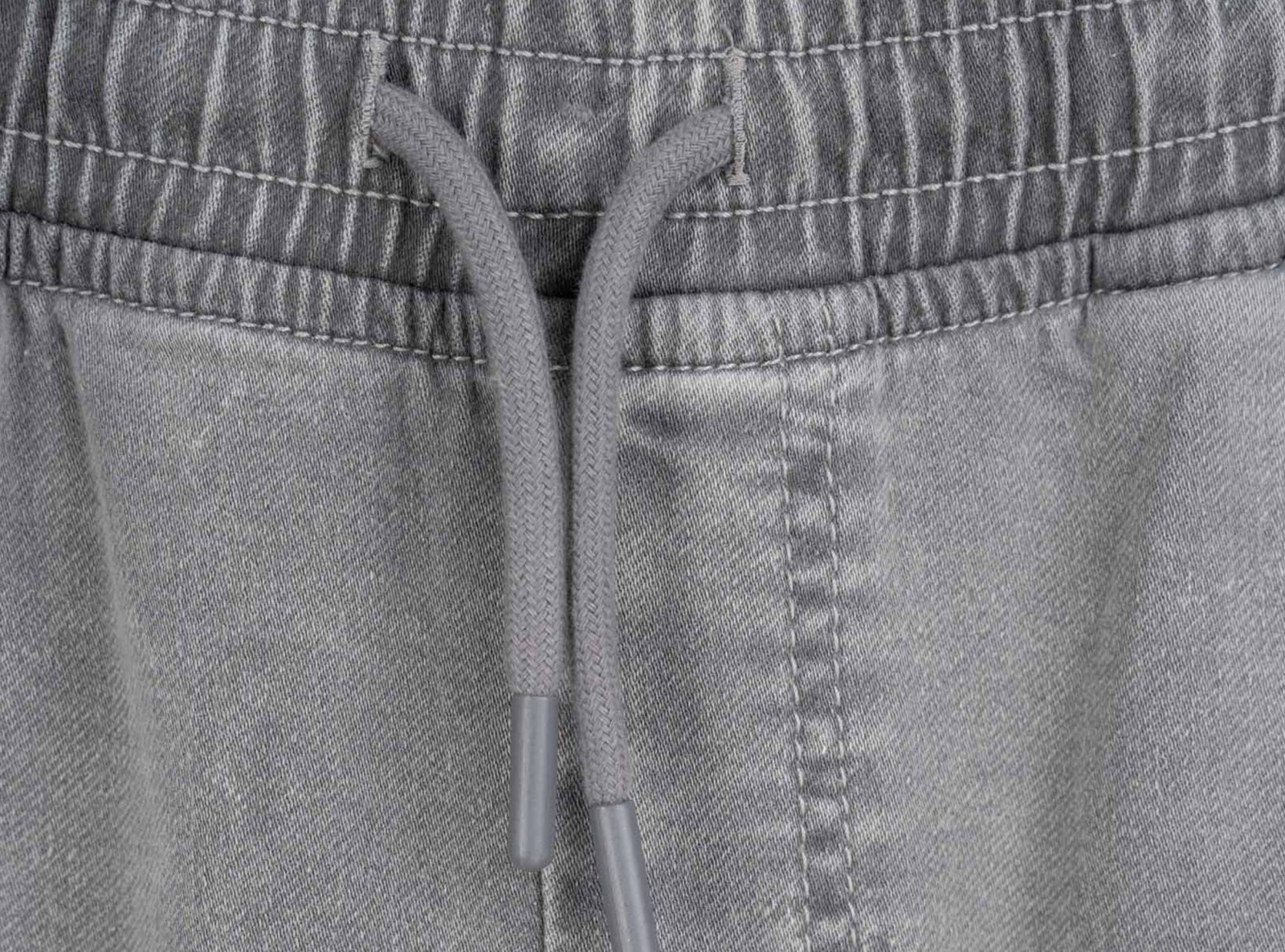 Jasnoszare spodnie jeansowe typu JOGGER z efektem sprania