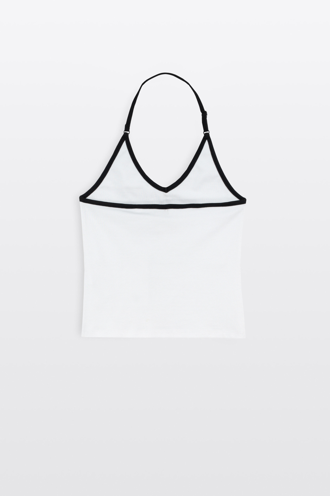 Biały top zakładany na szyje z kontrastową lamówką