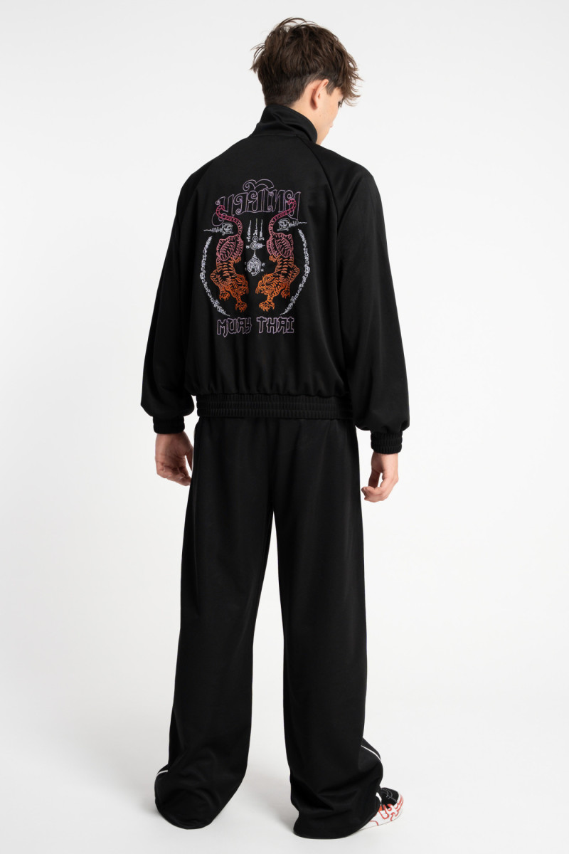 Czarne spodnie dresowe z szerokimi nogawkami z białym lampasem od Reporter